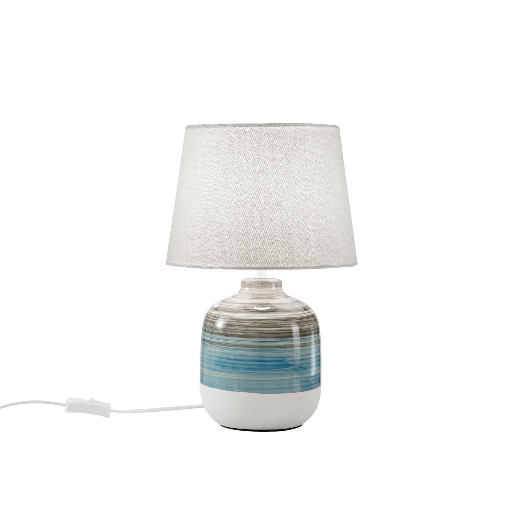 "Lume APACHE con base in ceramica e paralume in tessuto bianco."